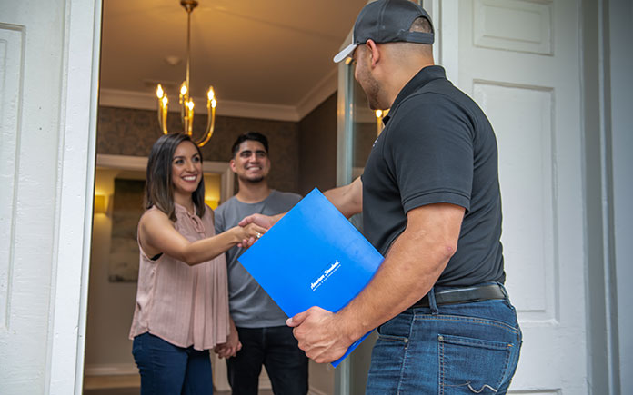 American Standard representative visits with a married couple at their home