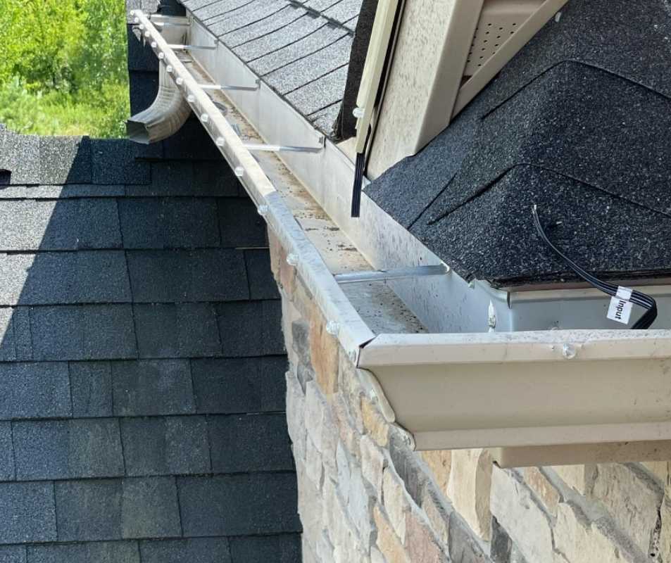 Guide To Hanging Christmas Lights on Gutters (2024) Today's Homeowner