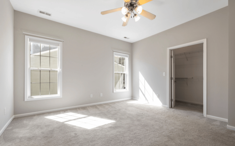 An empty room with carpet
