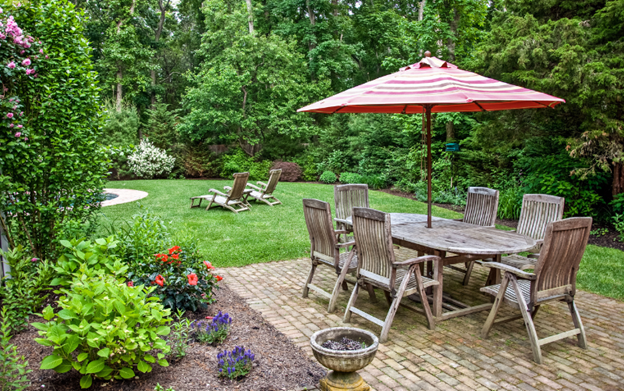 brick patio with wooden patio furniture